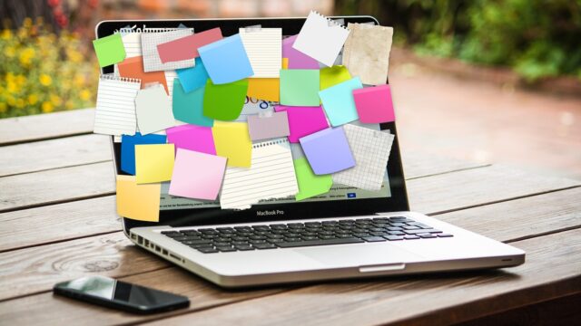 post-it notes, laptop, reminders