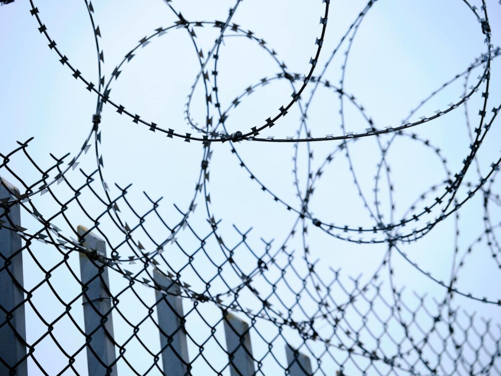 Chain Link Fence and Barbed Wires