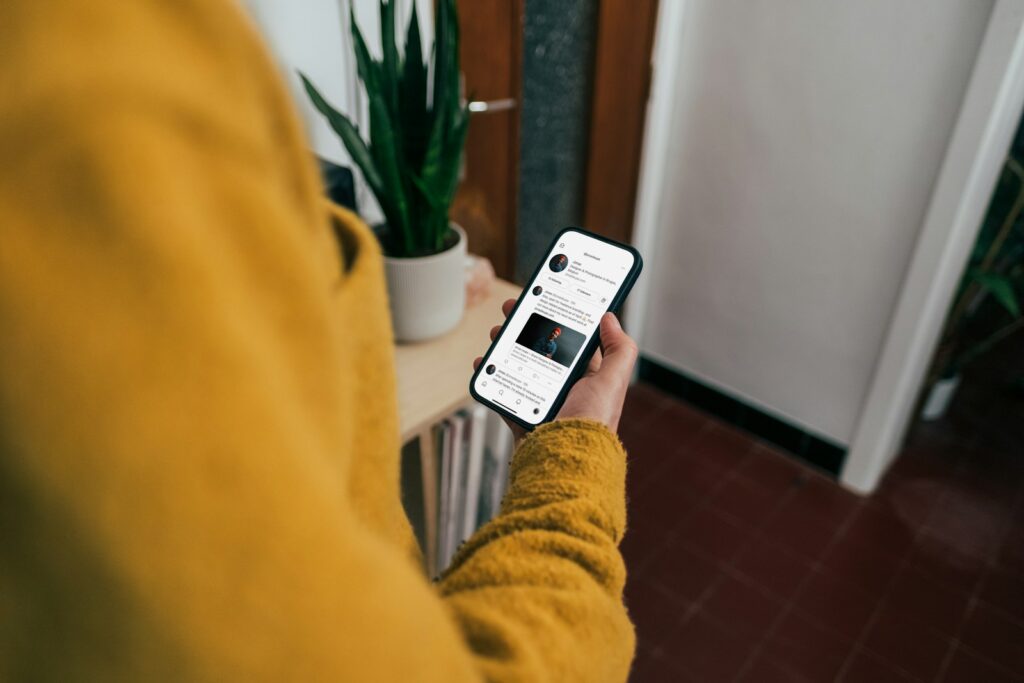 a person holding a cell phone in their hand