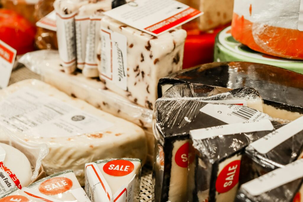 a table topped with lots of different types of cheese